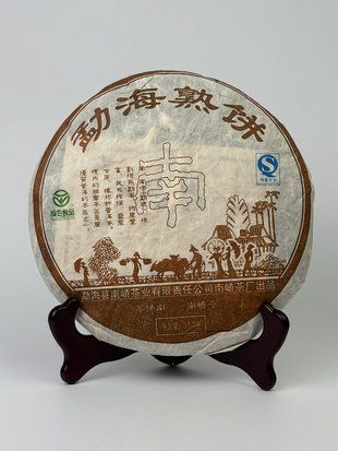 Витриманий колекційний Шу пуер N&aacute;n Ji&aacute;o Sh&uacute; Bǐng (南桥熟饼) 2007 рік - ноти горіхової пасти, чорносливу та сухофруктів 357г, Китай id_12685 фото